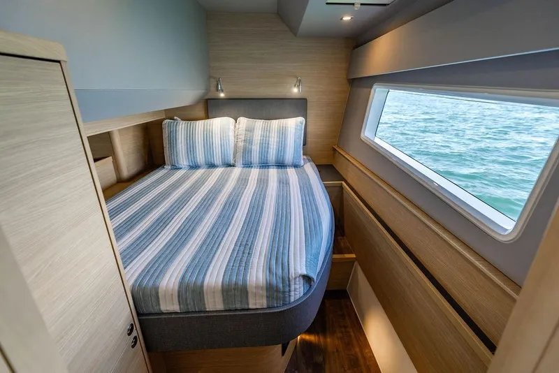 Slide: The Image of Luxurious cabin interior of 2024 Aquila 44 Yacht with ocean view window. - 76