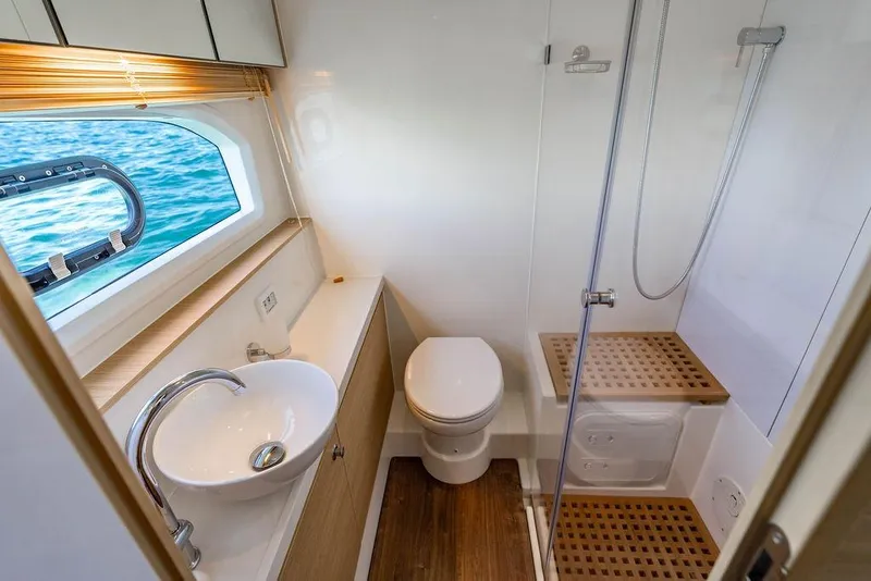 Slide: The Image of Luxurious bathroom on 2024 Aquila 44 Yacht with ocean view window. - 78
