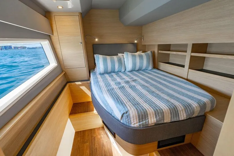 Slide: The Image of Luxurious cabin interior of 2024 Aquila 44 Yacht with ocean view window. - 81