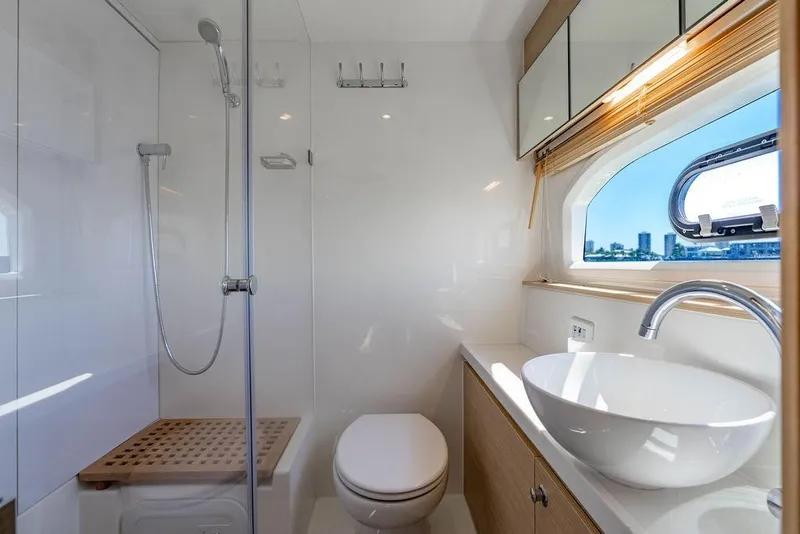 Slide: The Image of Luxurious bathroom on 2024 Aquila 44 Yacht with modern fixtures and ocean view. - 84