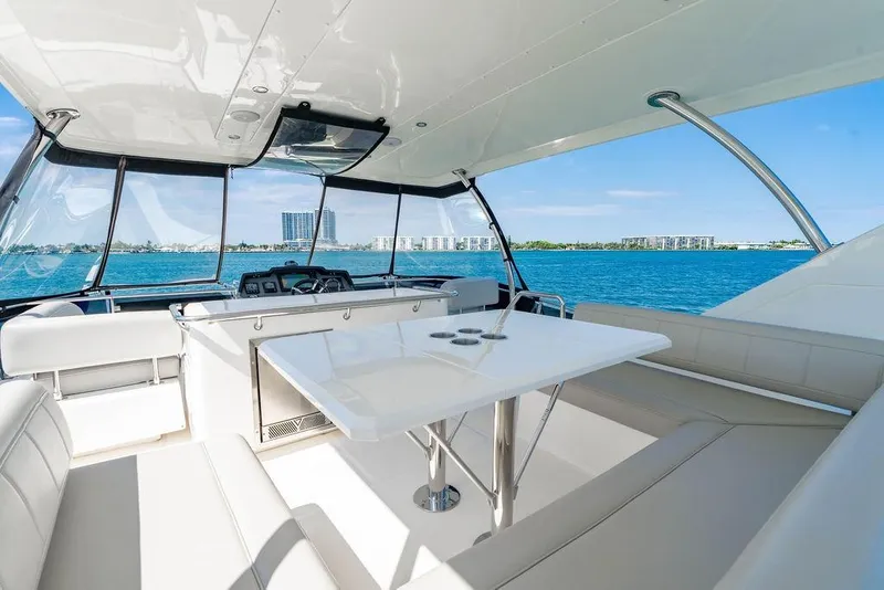 Slide: The Image of Luxurious 2024 Aquila 44 Yacht interior with sleek seating and ocean view. - 86