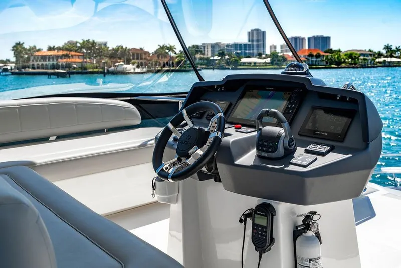 Slide: The Image of Cockpit of 2024 Aquila 44 Yacht with modern navigation controls and waterfront view. - 97