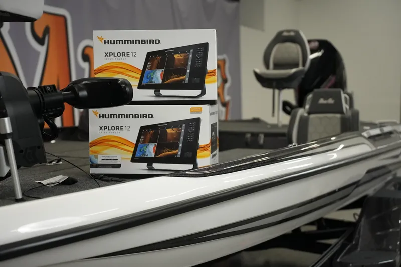 Slide: The Image of 2026 Bass Cat Puma STS boat with Humminbird XPLORE 12 fish finders displayed onboard. - 10