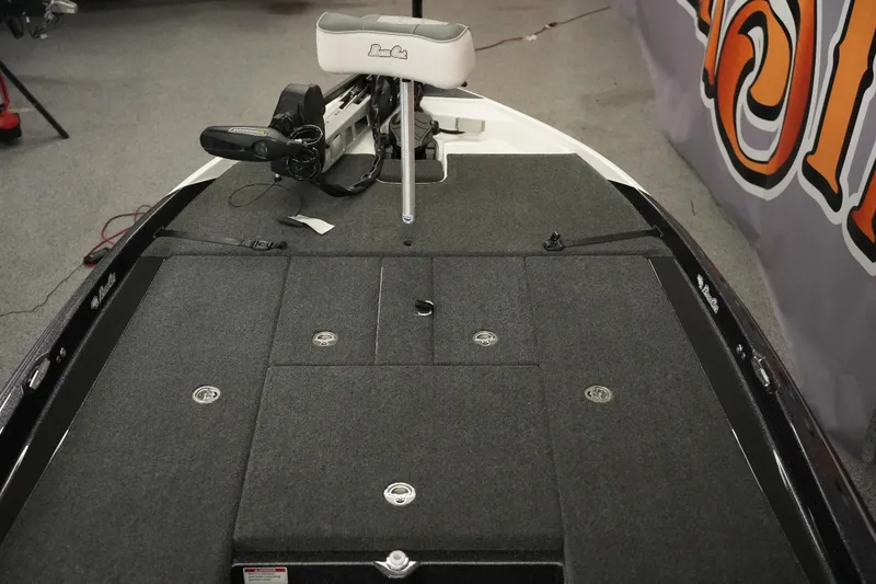 Slide: The Image of 2026 Bass Cat Puma STS boat deck with trolling motor and storage compartments. - 18