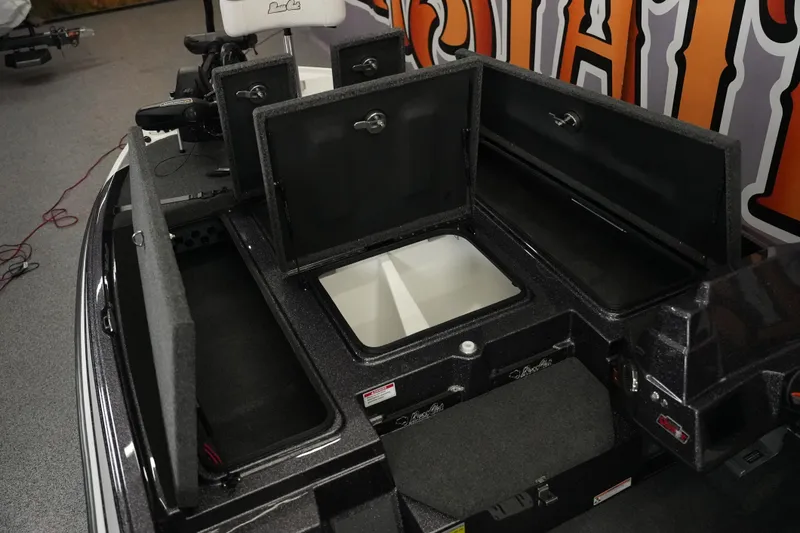Slide: The Image of 2026 Bass Cat Puma STS boat storage compartments open, showcasing spacious interior design. - 19