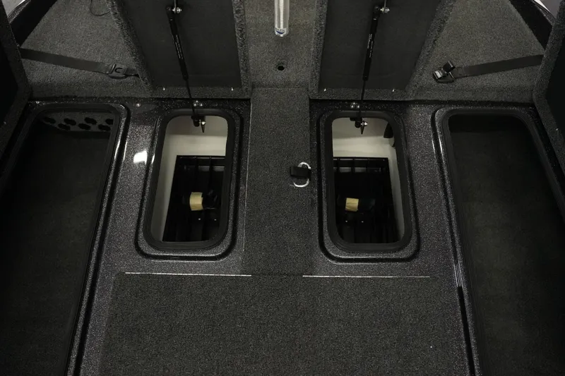 Slide: The Image of Interior storage compartments of 2026 Bass Cat Puma STS boat, featuring sleek design and ample space. - 20
