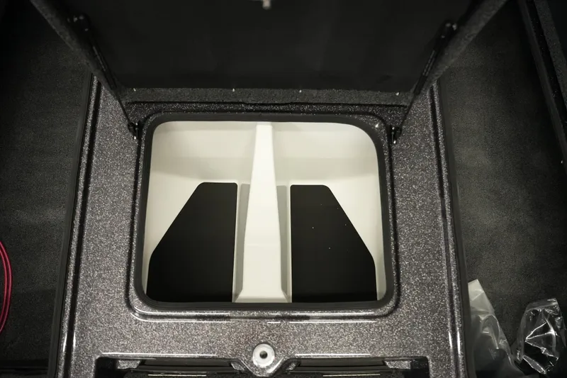 Slide: The Image of Open storage compartment in 2026 Bass Cat Puma STS boat, featuring a sleek, organized design. - 21