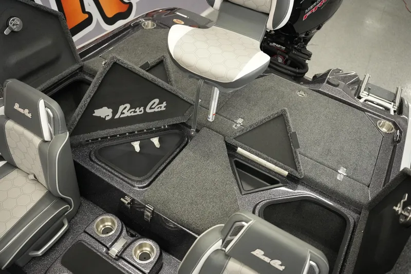 Slide: The Image of 2026 Bass Cat Puma STS boat interior with seating and storage compartments. - 26