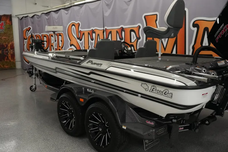 Slide: The Image of 2026 Bass Cat Puma STS boat in showroom, featuring sleek design and modern features. - 3