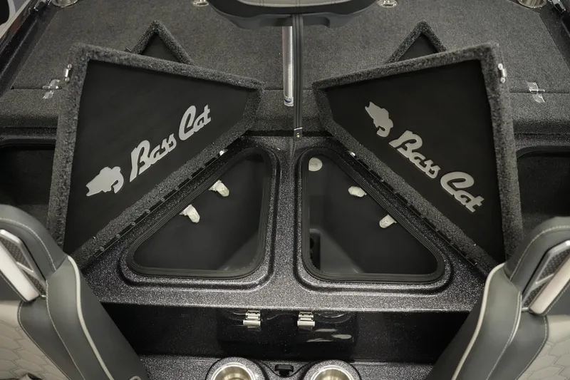 Slide: The Image of 2026 Bass Cat Puma STS boat storage compartments with open lids, showcasing interior design. - 30