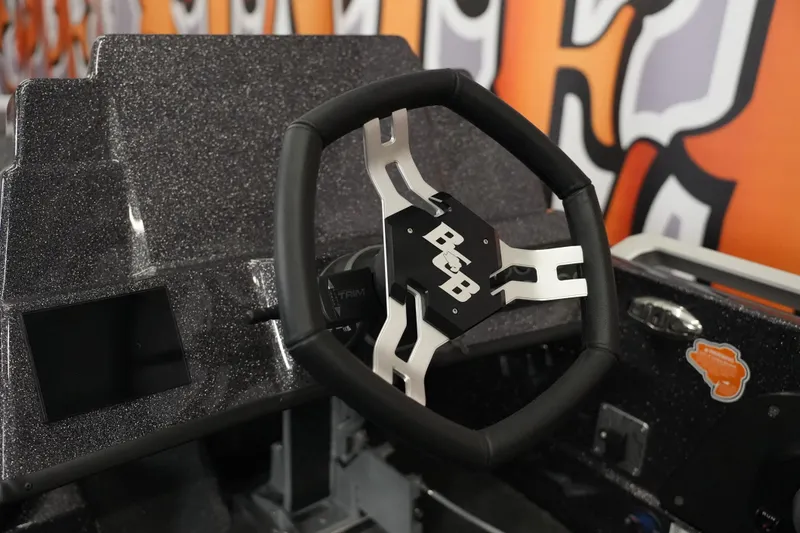 Slide: The Image of 2026 Bass Cat Puma STS steering wheel and dashboard detail. - 32