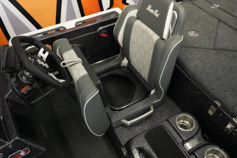 Slide: The Image of 2026 Bass Cat Puma STS boat interior with steering wheel and seating. - 33