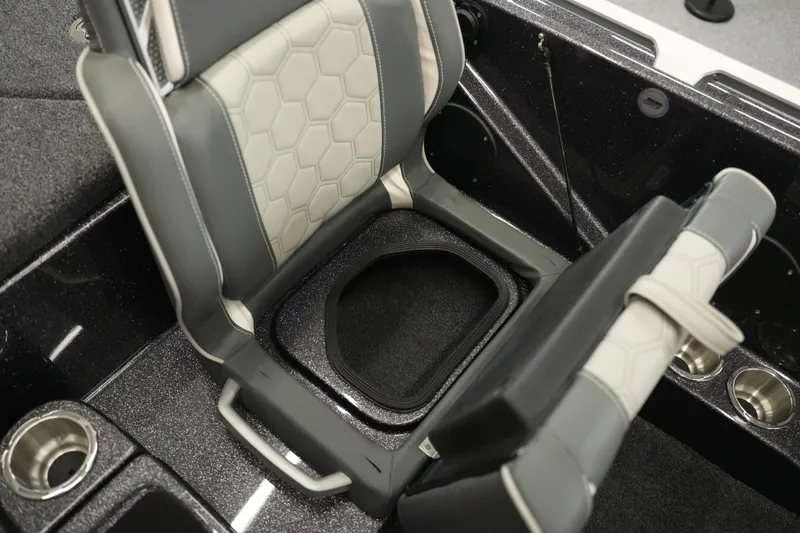 Slide: The Image of 2026 Bass Cat Puma STS boat seat with storage compartment and cup holders. - 34