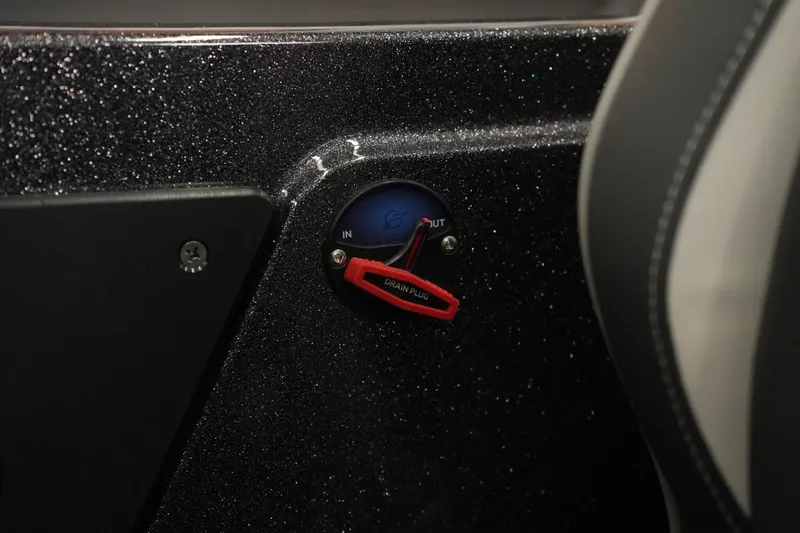 Slide: The Image of Bass Cat Puma STS 2026 boat drain plug control on glittery dashboard. - 36
