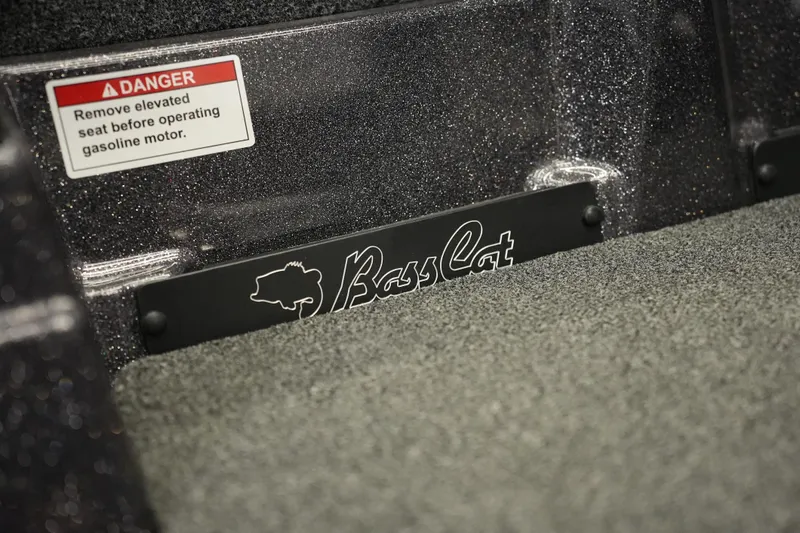 Slide: The Image of 2026 Bass Cat Puma STS interior with safety warning label and logo detail. - 41