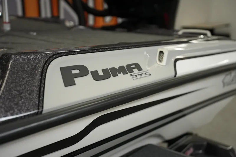 Slide: The Image of 2026 Bass Cat Puma STS boat, close-up of logo and sleek design. - 46