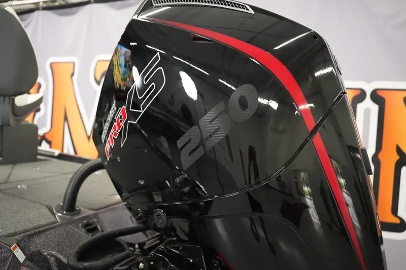 Slide: The Image of 2026 Bass Cat Puma STS with Mercury Pro XS 250 engine, sleek black and red design. - 47