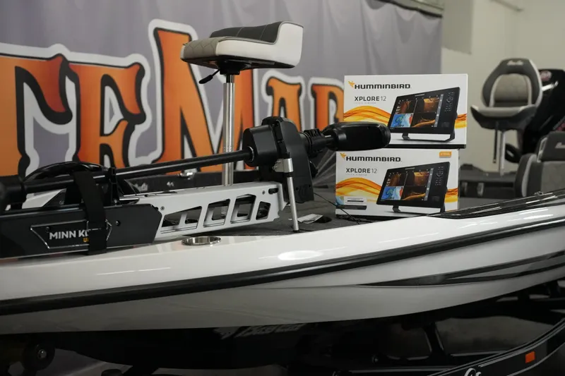 Slide: The Image of 2026 Bass Cat Puma STS boat with Minn Kota motor and Humminbird Xplore 12 displays. - 8