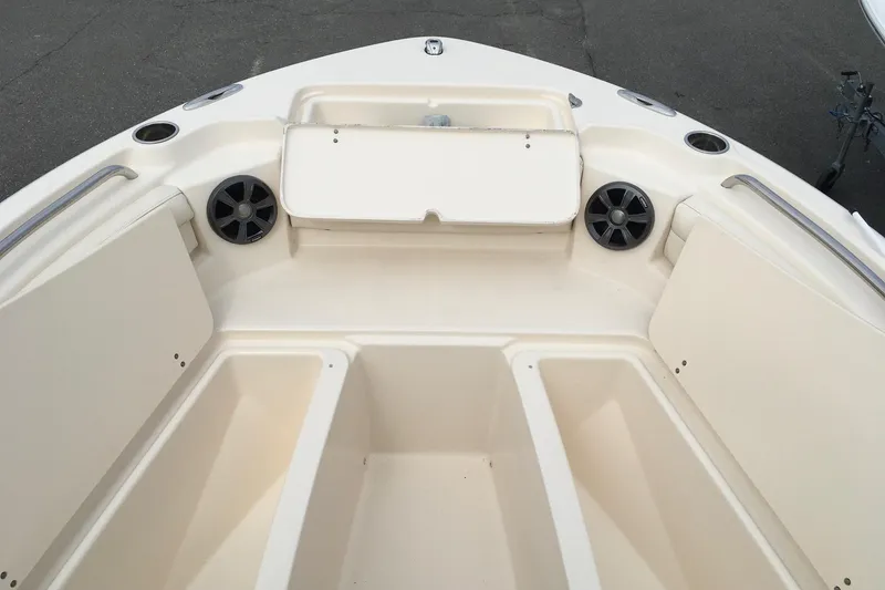 Slide: The Image of 2021 Grady-White Freedom 215 boat interior with seating and storage compartments. - 5