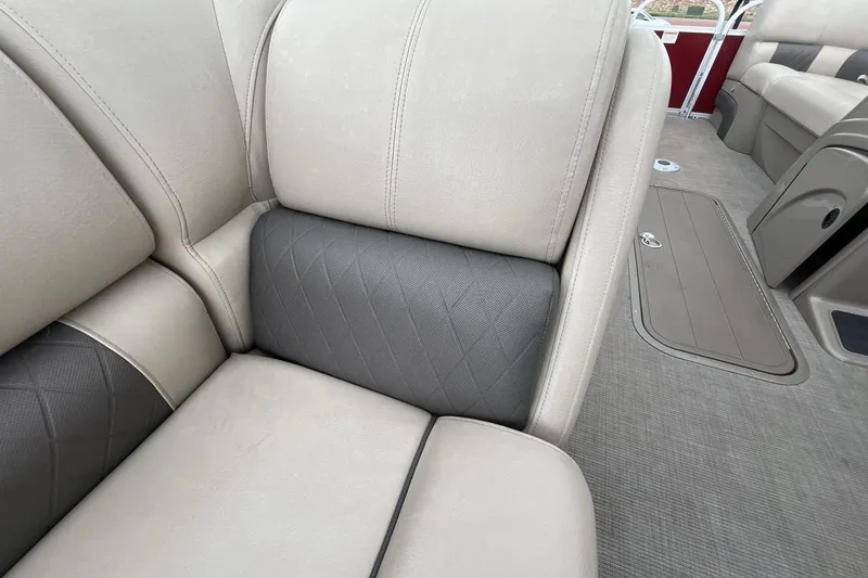 Slide: The Image of 2021 Sun Tracker Party Barge 22 XP3 interior seating, featuring beige and gray upholstery. - 17