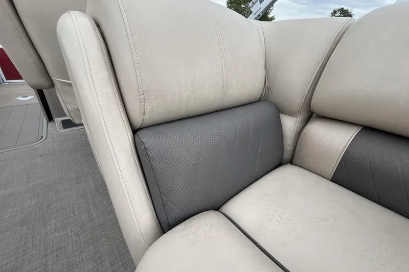 Slide: The Image of 2021 Sun Tracker Party Barge 22 XP3 interior seating, featuring beige and gray upholstery. - 20