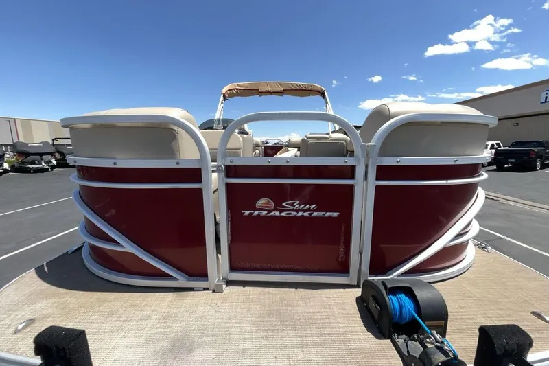 Slide: The Image of 2021 Sun Tracker Party Barge 22 XP3 pontoon boat, red exterior, parked outdoors. - 8
