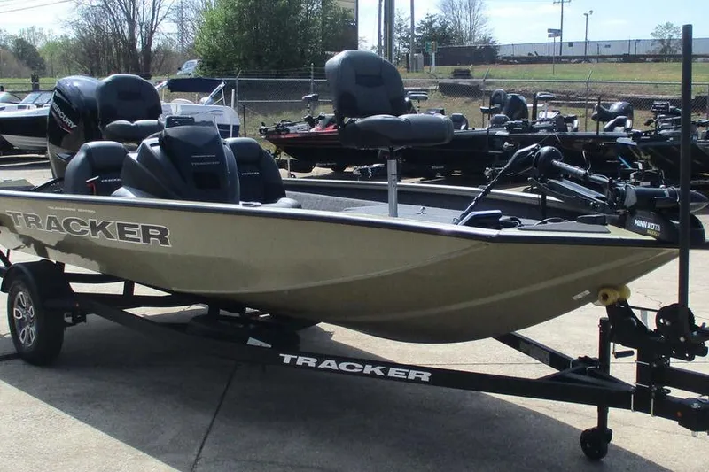 Slide: The Image of 2026 Tracker Pro Team 175 boat on trailer, parked outdoors. - 11