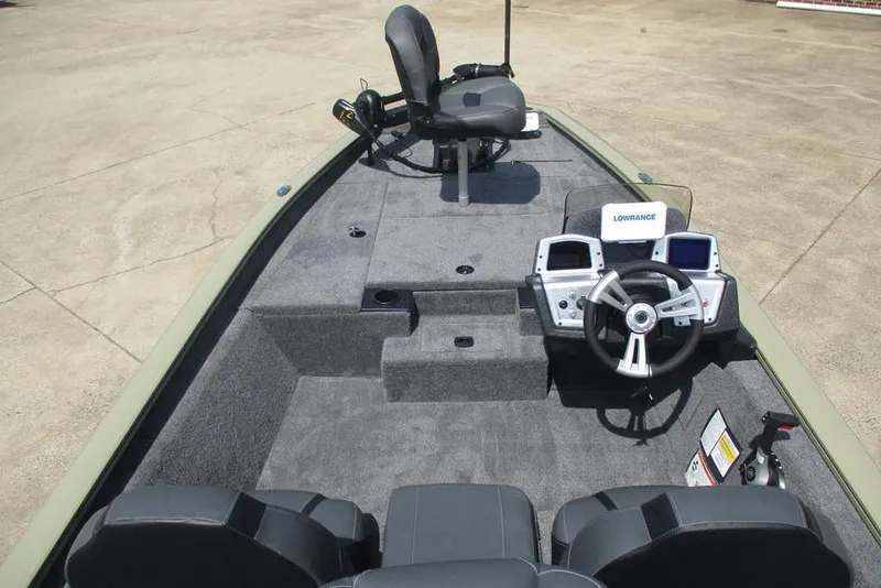 Slide: The Image of 2026 Tracker Pro Team 175 boat interior with steering console and seating. - 5