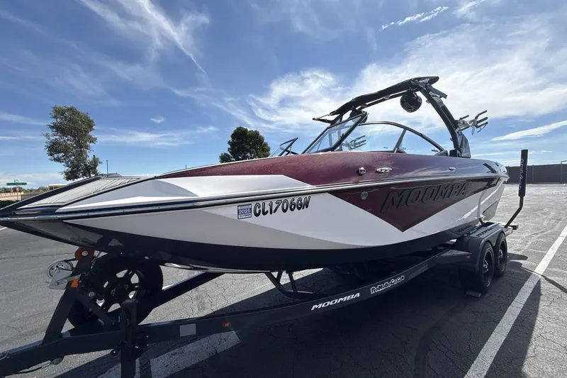 The Image of 2022 Moomba Makai boat on trailer under clear blue sky. - 1