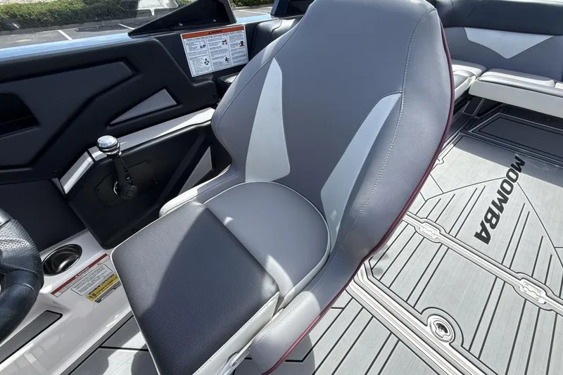 Slide: The Image of 2022 Moomba Makai boat interior with sleek seating and modern design elements. - 13