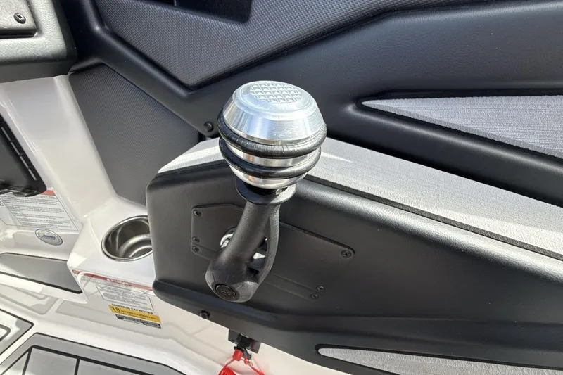 Slide: The Image of 2022 Moomba Makai boat throttle control with sleek design and metallic finish. - 16