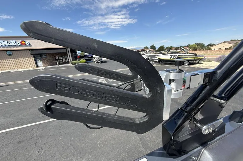 Slide: The Image of Roswell wakeboard rack on 2022 Moomba Makai boat, parked near a store. - 22