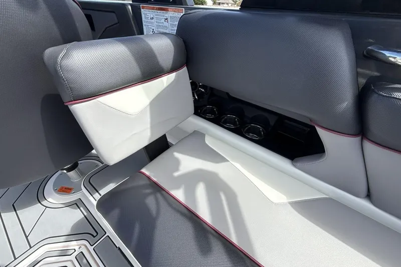 Slide: The Image of 2022 Moomba Makai boat interior with gray and white seating, cup holders, and sleek design. - 24