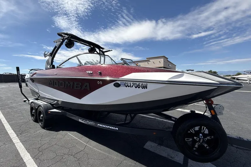 Slide: The Image of 2022 Moomba Makai boat on trailer under clear blue sky. - 7