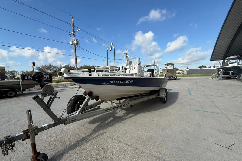 Slide: The Image of 2002 Pathfinder 1900 V boat on trailer under blue sky. - 9