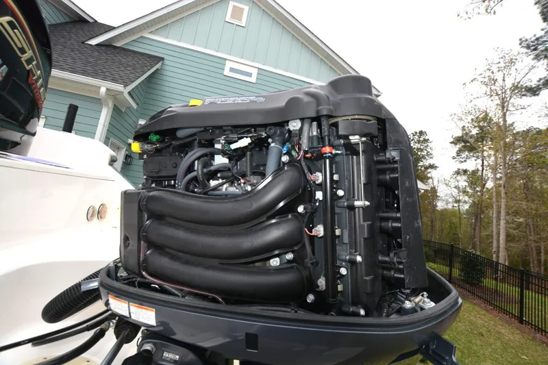 Slide: The Image of 2023 Robalo R230 Center Console boat engine, detailed view outdoors. - 16