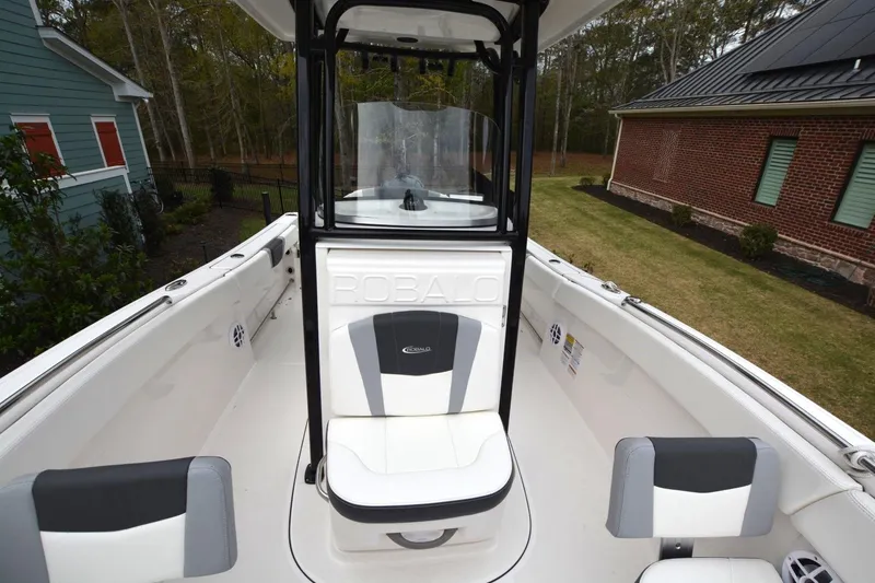 Slide: The Image of 2023 Robalo R230 Center Console boat interior with seating and console view. - 8