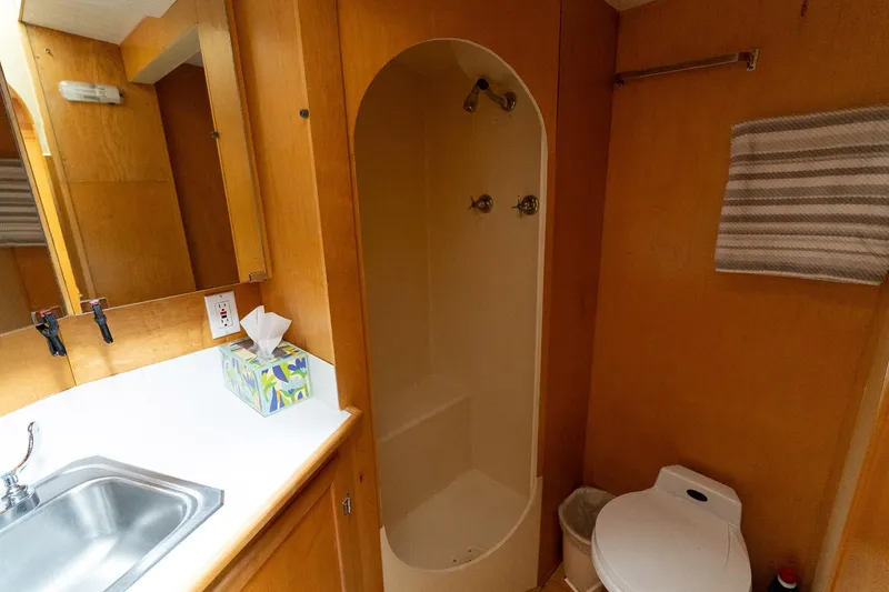 Slide: The Image of Bathroom interior of 1997 Custom Steel Trawler with shower, sink, and toilet. - 33