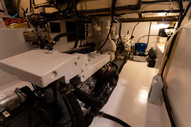 Slide: The Image of Engine room of a 1997 Custom Steel Trawler, showcasing machinery and equipment. - 37