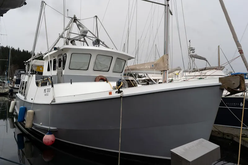 Slide: The Image of Custom 1997 Steel Trawler docked in marina, overcast sky, Seattle. - 5