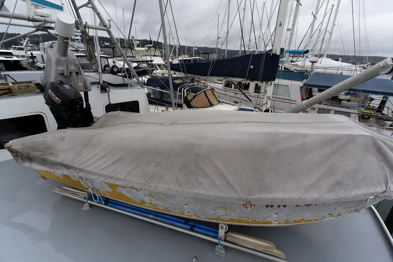 Slide: The Image of Covered boat on a 1997 Custom Steel Trawler, docked in a marina. - 7