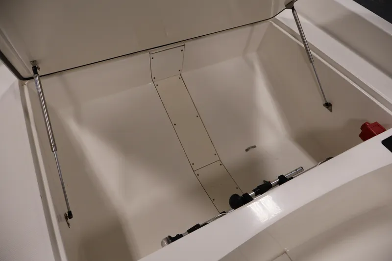 Slide: The Image of Open storage compartment of 2022 Mako Pro Skiff 17 CC boat. - 12