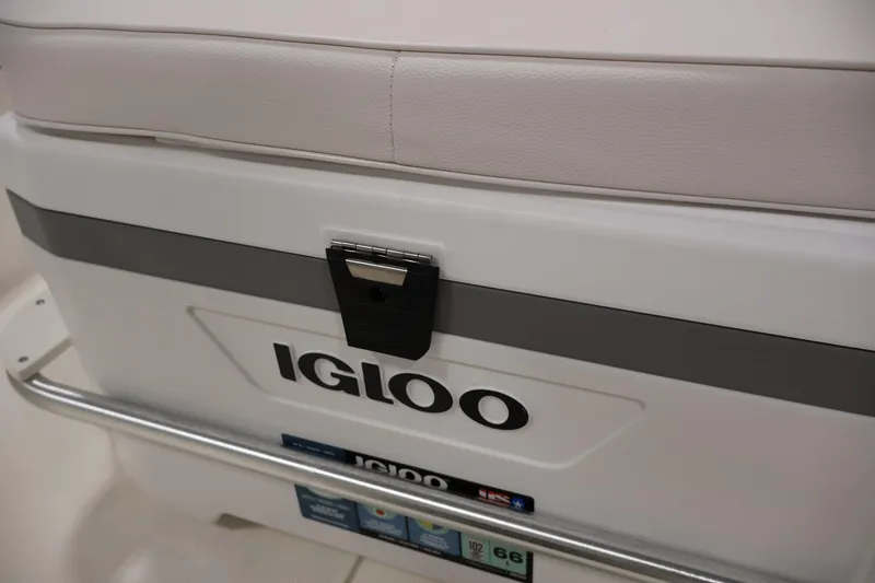 Slide: The Image of Igloo cooler on 2022 Mako Pro Skiff 17 CC boat, featuring secure latch. - 24