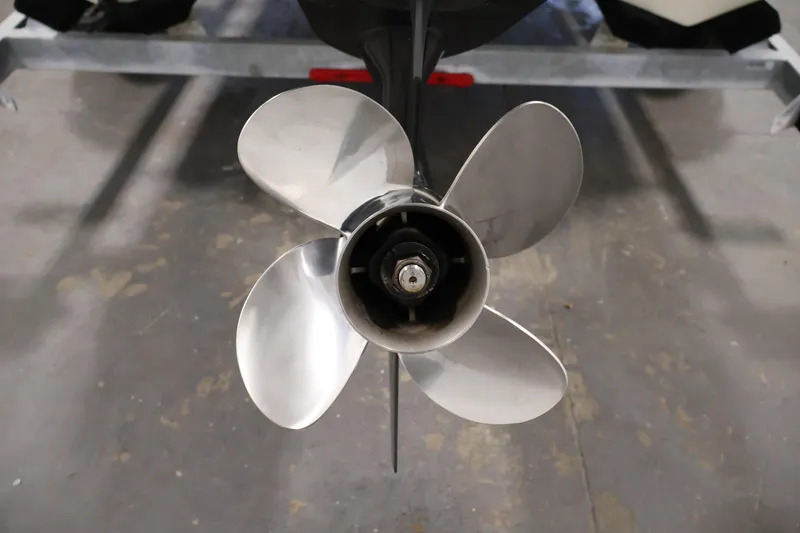 Slide: The Image of Propeller of 2022 Mako Pro Skiff 17 CC boat on a trailer. - 32
