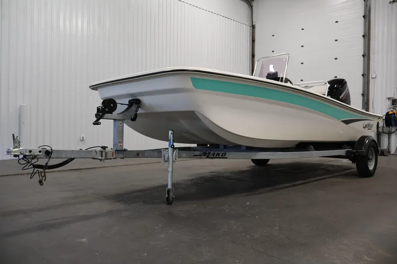 Slide: The Image of 2022 Mako Pro Skiff 17 CC boat on trailer in indoor storage. - 35