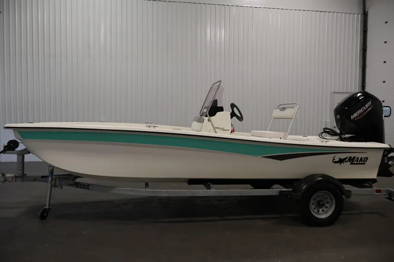 Slide: The Image of 2022 Mako Pro Skiff 17 CC boat on trailer in indoor setting. - 7