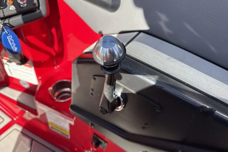 Slide: The Image of Close-up of 2022 Moomba Mojo boat throttle lever and controls. - 16