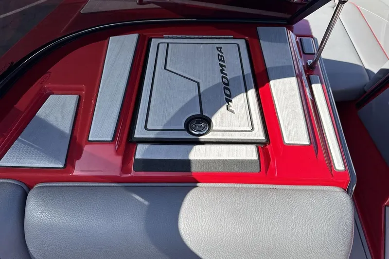 Slide: The Image of 2022 Moomba Mojo boat interior with red and gray accents. - 18