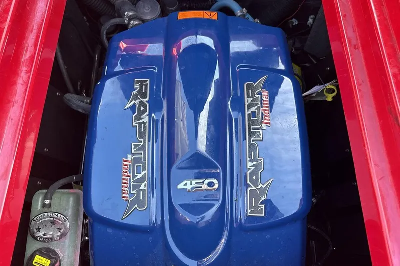 Slide: The Image of 2022 Moomba Mojo engine featuring a blue Indmar Raptor 450 cover. - 20