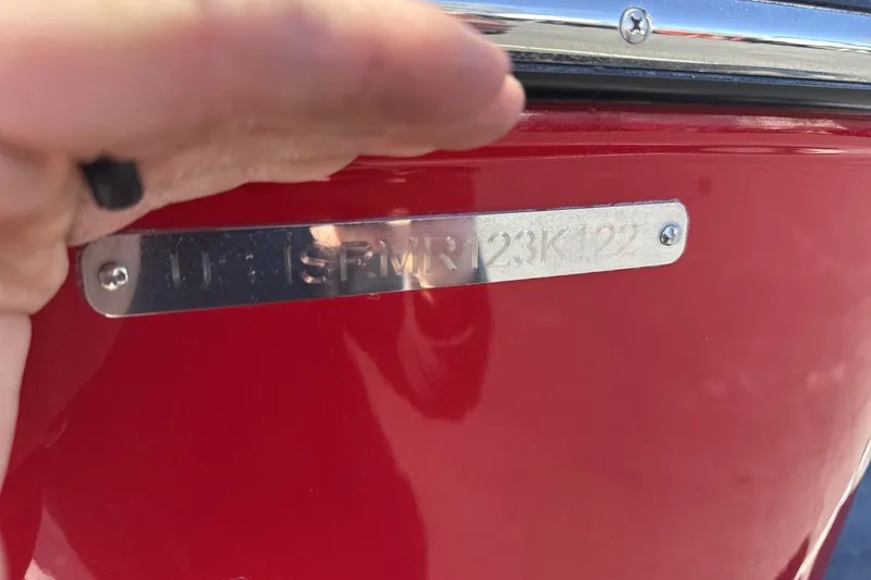 Slide: The Image of Red 2022 Moomba Mojo boat with visible identification plate. - 28